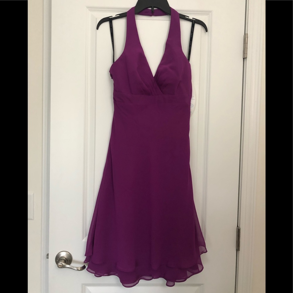 Brand new. Purple dress with halter neck.